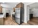 Modern kitchen featuring stainless steel appliances and hardwood floors at 31 W Fremont Ave, Littleton, CO 80120