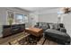 Cozy living room with wood burning fireplace and large windows at 31 W Fremont Ave, Littleton, CO 80120