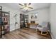 Bright living room with wood floors, large windows, and a comfy chair at 31 W Fremont Ave, Littleton, CO 80120