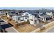 Aerial view of a modern home with a fenced backyard and patio space at 65 Newport St, Denver, CO 80230