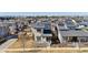 An aerial view of the modern homes in this neighborhood showcasing solar panels at 65 Newport St, Denver, CO 80230