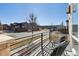 Relaxing balcony with comfortable seating and neighborhood views at 65 Newport St, Denver, CO 80230