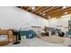 Unfinished basement with exposed beams, concrete floor, and potential for customization at 65 Newport St, Denver, CO 80230