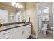 Modern bathroom features a single sink with a granite countertop and walk-in shower at 65 Newport St, Denver, CO 80230