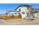 Contemporary home featuring a stone facade and a fenced yard at 65 Newport St, Denver, CO 80230