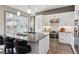 Stylish kitchen featuring granite counters, stainless steel appliances, a tiled backsplash, and barstool seating at 65 Newport St, Denver, CO 80230