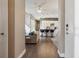 Open-concept living room with hardwood floors flowing into the modern kitchen at 65 Newport St, Denver, CO 80230