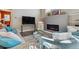 Cozy living area featuring a modern fireplace, ample seating, and a stylish glass coffee table at 65 Newport St, Denver, CO 80230