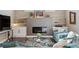 Inviting living room with a modern fireplace, built-in shelving, and comfortable seating arrangement at 65 Newport St, Denver, CO 80230
