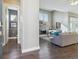 Open-concept living room with fireplace, hardwood floors, and abundant natural light at 65 Newport St, Denver, CO 80230