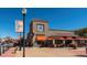 Lowry Town Center restaurant with outdoor patio and nearby retail shops at 65 Newport St, Denver, CO 80230