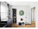 Bright bedroom features an organized closet, white walls, and hardwood floors for a modern, airy living space at 873 S Raritan St, Denver, CO 80223