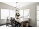 Bright dining area featuring large windows, modern lighting, and built-in bench seating at 873 S Raritan St, Denver, CO 80223