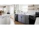Well-designed kitchen features modern appliances and ample countertop space at 873 S Raritan St, Denver, CO 80223
