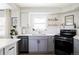 Bright kitchen featuring modern appliances, stone countertops, and sleek finishes at 873 S Raritan St, Denver, CO 80223