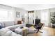 Bright and airy living room featuring stylish furnishings and natural light at 873 S Raritan St, Denver, CO 80223