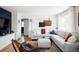 Comfortable living room showcasing a plush sofa, modern decor, and wood floors at 873 S Raritan St, Denver, CO 80223