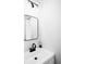 Clean powder room with a modern sink, faucet, square mirror, and stylish lighting at 873 S Raritan St, Denver, CO 80223