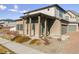 Two-story townhome with attached garage and front landscaping at 19059 E 54Th Pl, Denver, CO 80249