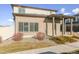 Two-story home with a covered porch and attached garage.Landscaped yard at 19059 E 54Th Pl, Denver, CO 80249