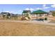 Community playground with play structures, a covered picnic area at 19059 E 54Th Pl, Denver, CO 80249