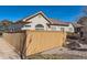 Beautiful house features a wooden fence, with rock landscaping, perfect for privacy and charm at 71 Woodland Cir, Highlands Ranch, CO 80126