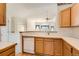 Kitchen with an open concept with updated appliances and cabinetry at 71 Woodland Cir, Highlands Ranch, CO 80126