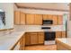 Updated kitchen with appliances and generous cabinet space at 71 Woodland Cir, Highlands Ranch, CO 80126