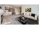 Open concept living room with fireplace and view of the breakfast bar at 71 Woodland Cir, Highlands Ranch, CO 80126