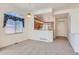Open-concept living room and view of the adjacent breakfast bar at 71 Woodland Cir, Highlands Ranch, CO 80126