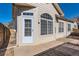 Sunny sun room featuring large arched windows and an exterior door at 71 Woodland Cir, Highlands Ranch, CO 80126