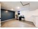 Basement area with painted floor and walls, fish tanks, and a small window at 7840 W Portland Ave, Littleton, CO 80128