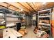 Basement storage area featuring wire shelving and exposed wood beams at 7840 W Portland Ave, Littleton, CO 80128