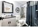Tidy bathroom featuring a shower and bathtub combo with tiled walls at 7840 W Portland Ave, Littleton, CO 80128