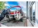 Pontoon boat on a trailer parked next to the home at 7840 W Portland Ave, Littleton, CO 80128