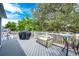 Outdoor deck featuring patio furniture, a grill, and a seating area for entertaining guests at 7840 W Portland Ave, Littleton, CO 80128