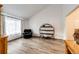 Bright living room featuring vaulted ceiling, wood floors, neutral paint and a comfortable armchair at 7840 W Portland Ave, Littleton, CO 80128