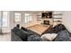 Bright living room showcases a stone fireplace with built-in shelving at 7840 W Portland Ave, Littleton, CO 80128