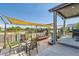 Backyard patio with seating area, pergola, and a grill at 15983 E Warner Dr, Denver, CO 80239