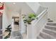 Bright entryway with stairs leading upstairs, showcasing light flooring at 15983 E Warner Dr, Denver, CO 80239