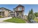 Two-story house with gray siding, stone, and a basketball hoop at 15983 E Warner Dr, Denver, CO 80239