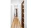 Bright hallway with wooden floors, modern doors, and a skylight bringing in lots of natural light at 5945 Dudley Ct, Arvada, CO 80004