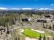 Scenic aerial view of a home near a golf course with stunning mountain views in the background at 2250 Highlands Dr, Breckenridge, CO 80424
