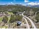 Panoramic aerial view of a luxury property nestled among trees, showcasing the sprawling landscape and mountain backdrop at 2250 Highlands Dr, Breckenridge, CO 80424