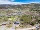 Breathtaking aerial view of mountain home situated on golf course with mountain views at 2250 Highlands Dr, Breckenridge, CO 80424
