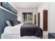 Modern bedroom featuring a comfortable bed, contemporary artwork, and a calming view of the natural surroundings at 2250 Highlands Dr, Breckenridge, CO 80424