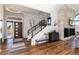 Inviting entryway with hardwood floors, modern lighting, and a grand staircase with metal railings at 2250 Highlands Dr, Breckenridge, CO 80424