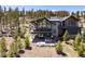 Stunning back exterior featuring deck and hot tub area, with beautiful mountain backdrop at 2250 Highlands Dr, Breckenridge, CO 80424