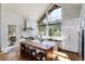 Open kitchen features an island with seating, chef's appliances, and expansive windows with views at 2250 Highlands Dr, Breckenridge, CO 80424