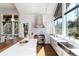 This open kitchen is bright and features stainless steel appliances, white cabinets, and an island with natural wood accents at 2250 Highlands Dr, Breckenridge, CO 80424